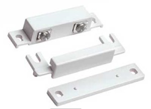 A white plastic door handle and latch set.